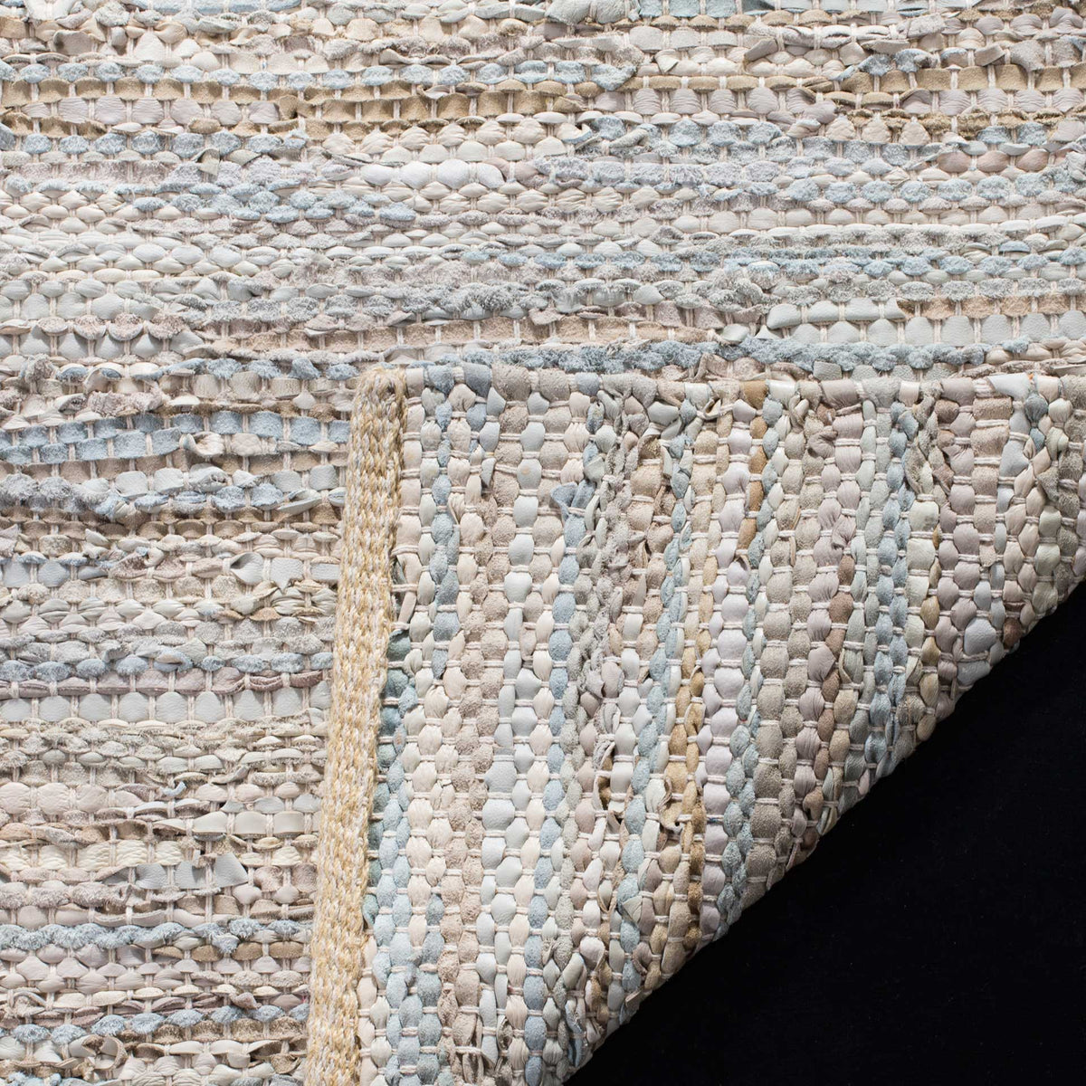 Woven underside reveals interlaced beige leather and cotton fibers
