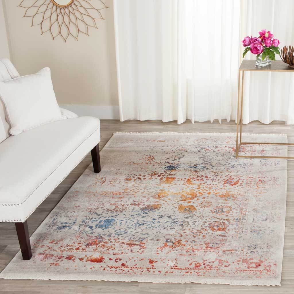 Pale floral rug adds hints of rust and blue to a bright living room