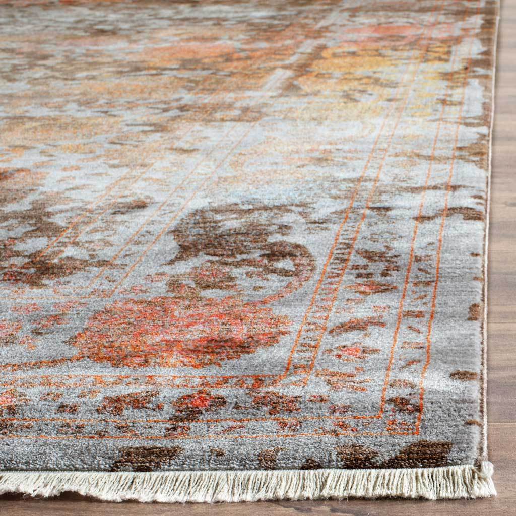 Cream fringe adds a soft finish to layered brown and orange floral motifs