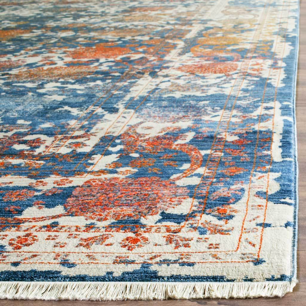 Ivory fringe borders richly layered turquoise and rust botanical motifs