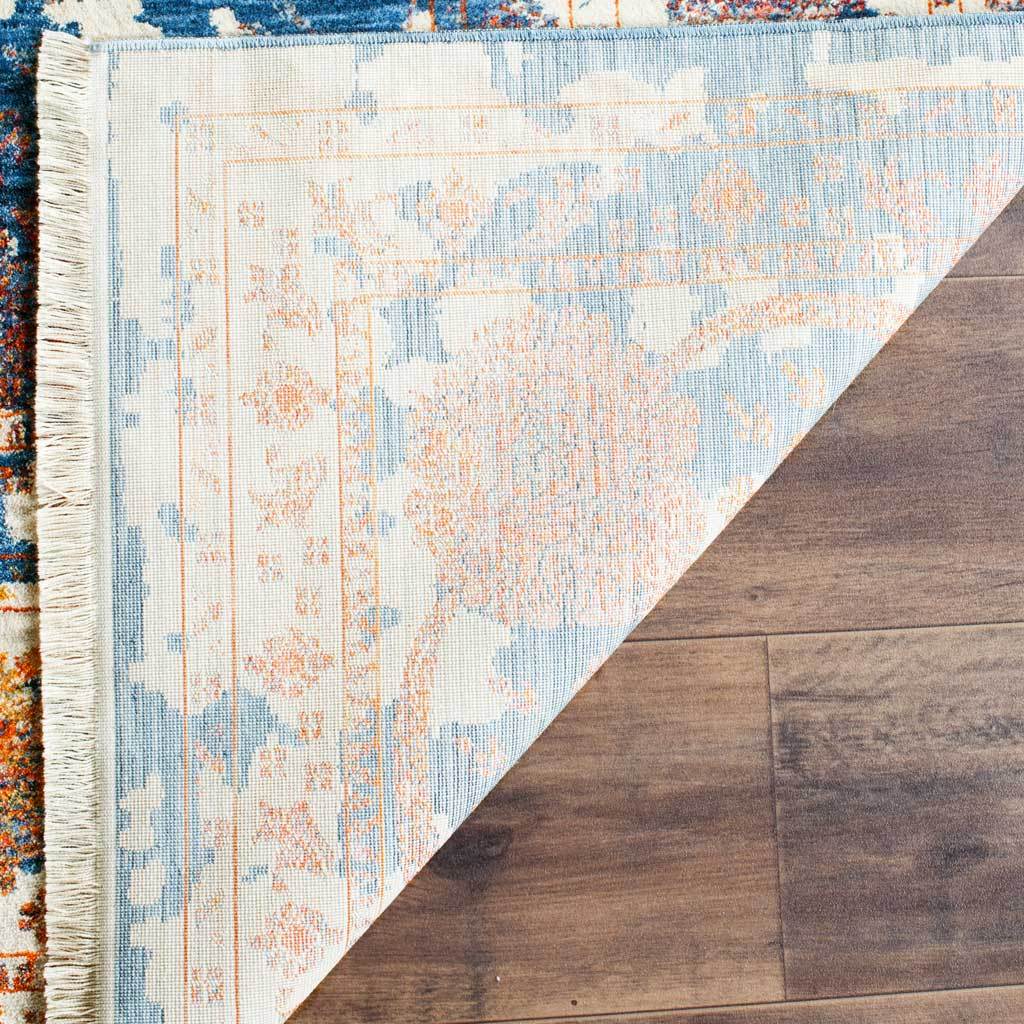 Pale woven reverse reveals faint blue and orange floral detailing