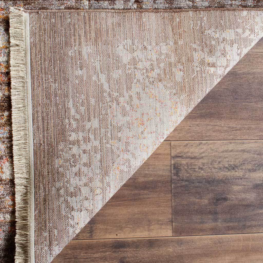 Woven cotton reverse carries a muted brown and cream botanical pattern