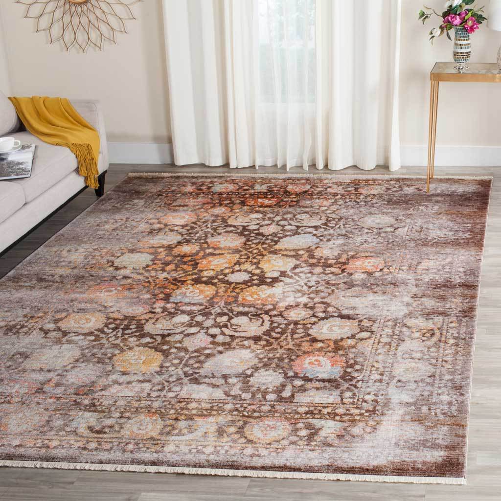 Rich brown floral rug lends warmth and ornate detail to a bright interior