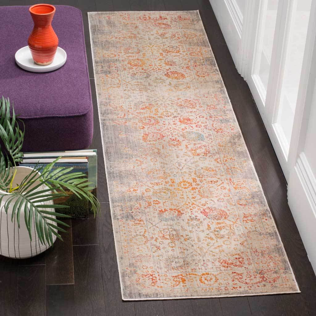 Light gray runner scatters warm orange and blush botanical accents across a washed surface