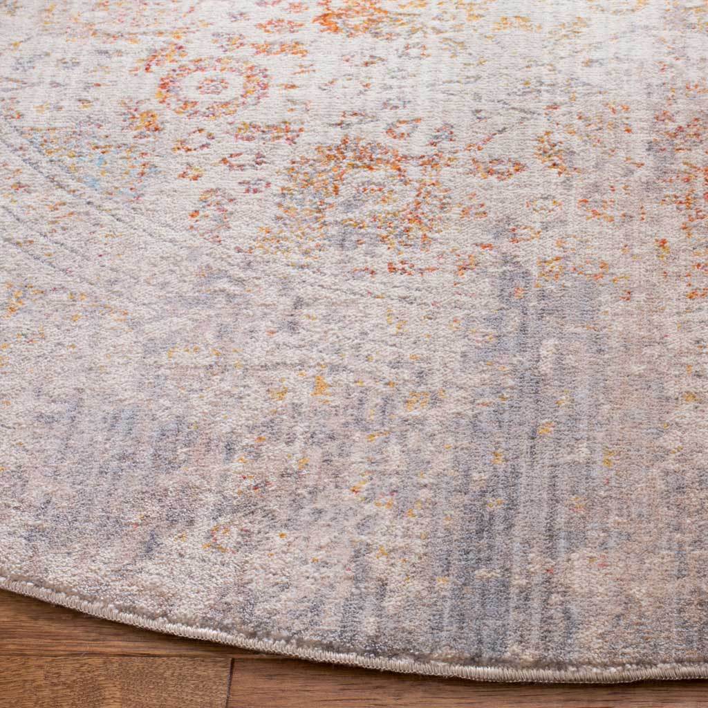 Subtle gray and rust motifs blend across a low-profile pile with a neatly finished edge.