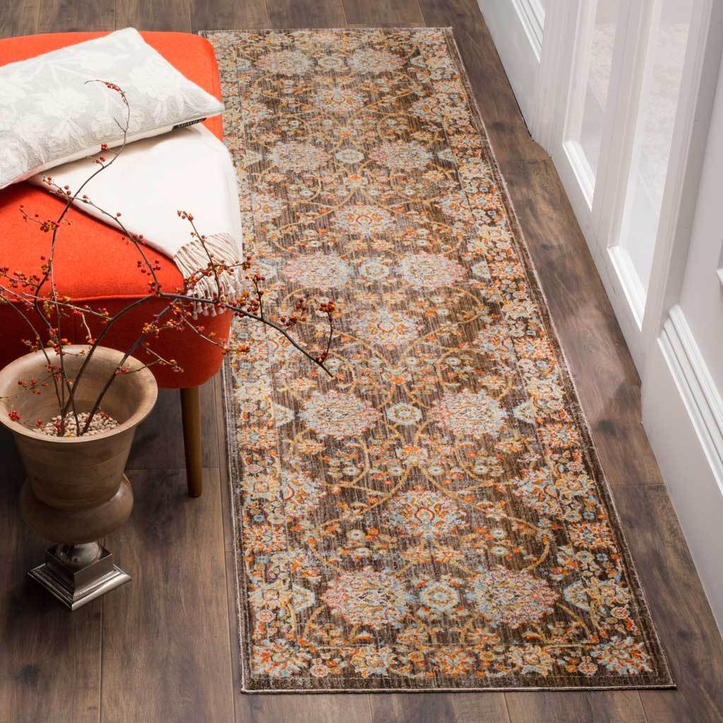 Earthy brown runner features warm gold flowers and intricate winding foliage