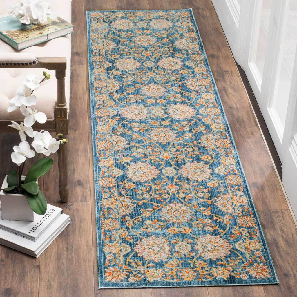 Deep blue runner pairs curling floral stems with warm golden highlights