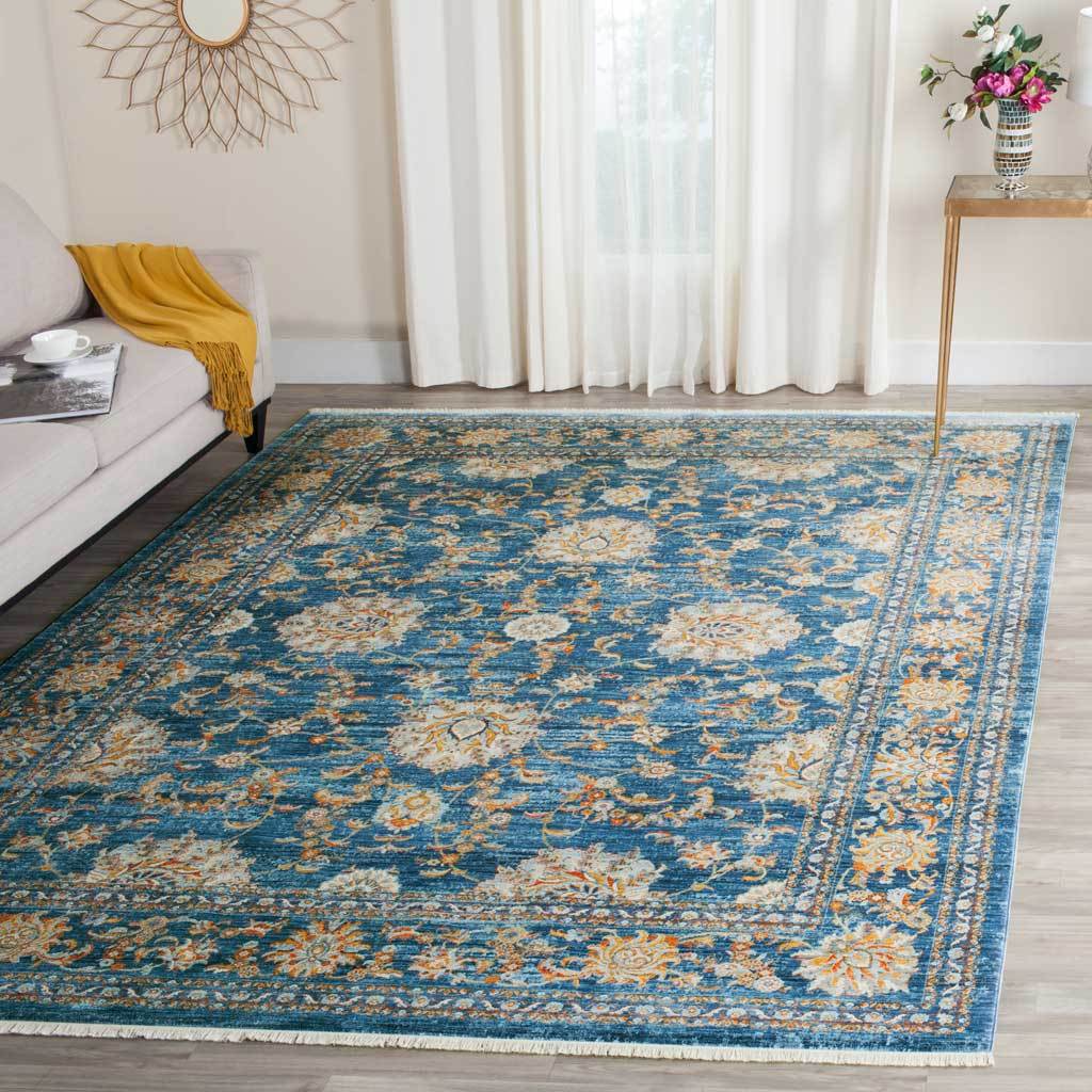 Deep turquoise rug adds glowing orange blossoms to a bright living space