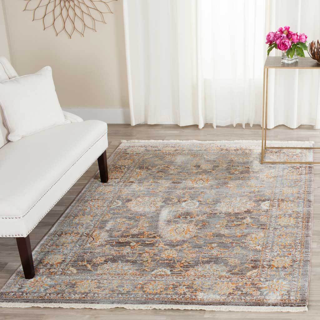 Light brown floral rug softens a bright sitting room with warm accents