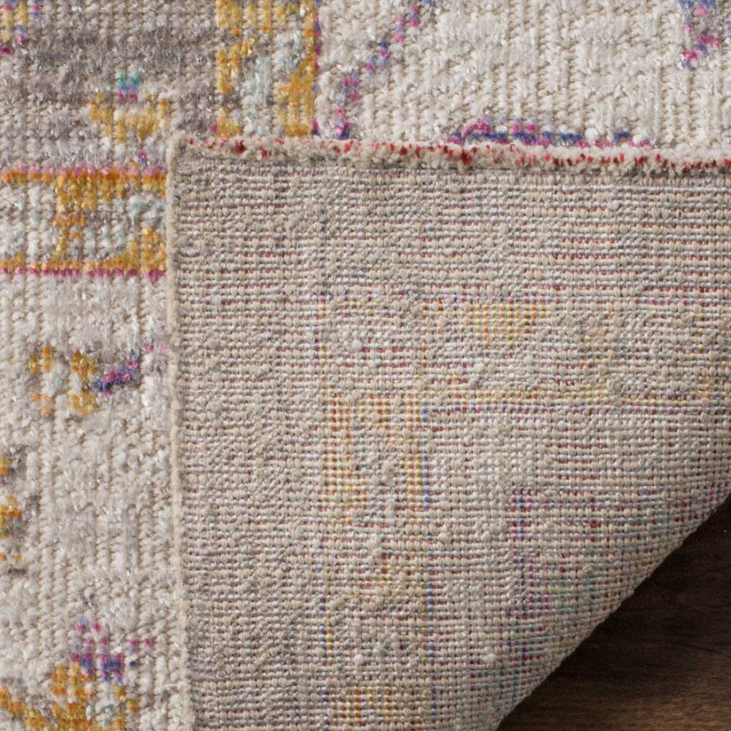 A folded edge reveals the rug's tightly woven backing beneath its patterned surface