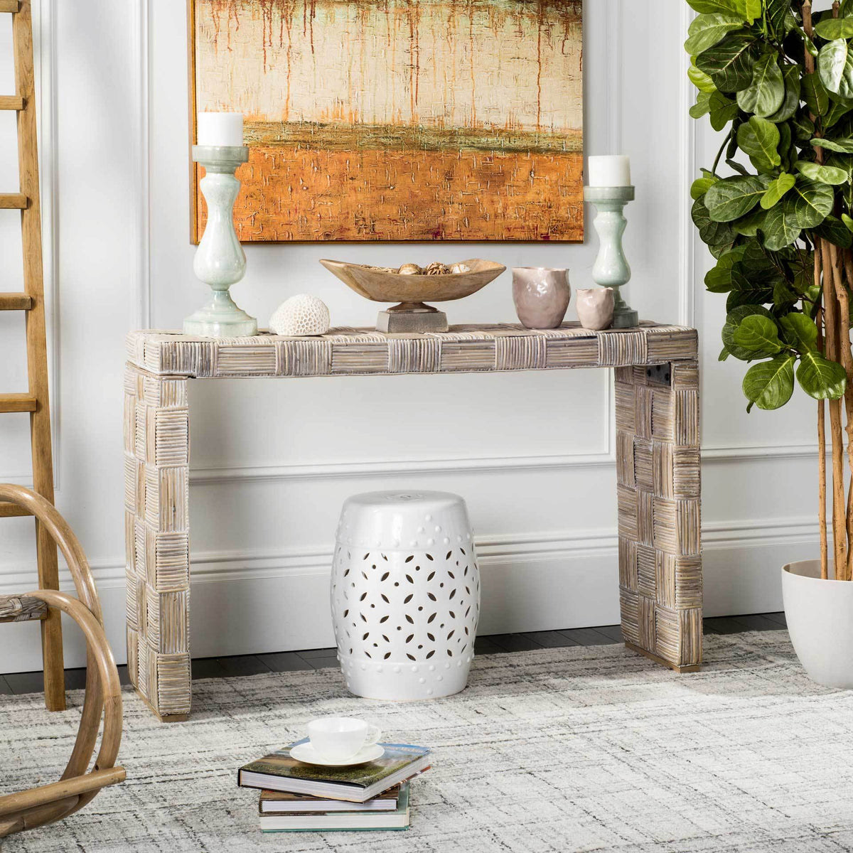 Whitewashed rattan console brings woven texture and an open silhouette to a bright living room