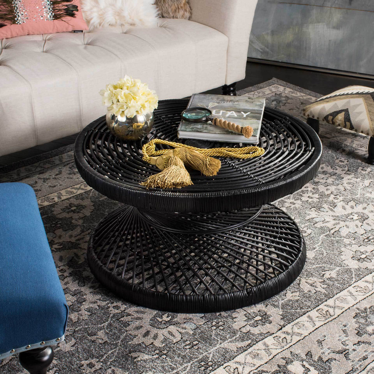 Circular woven top and open lattice base bring sculptural texture to a living room
