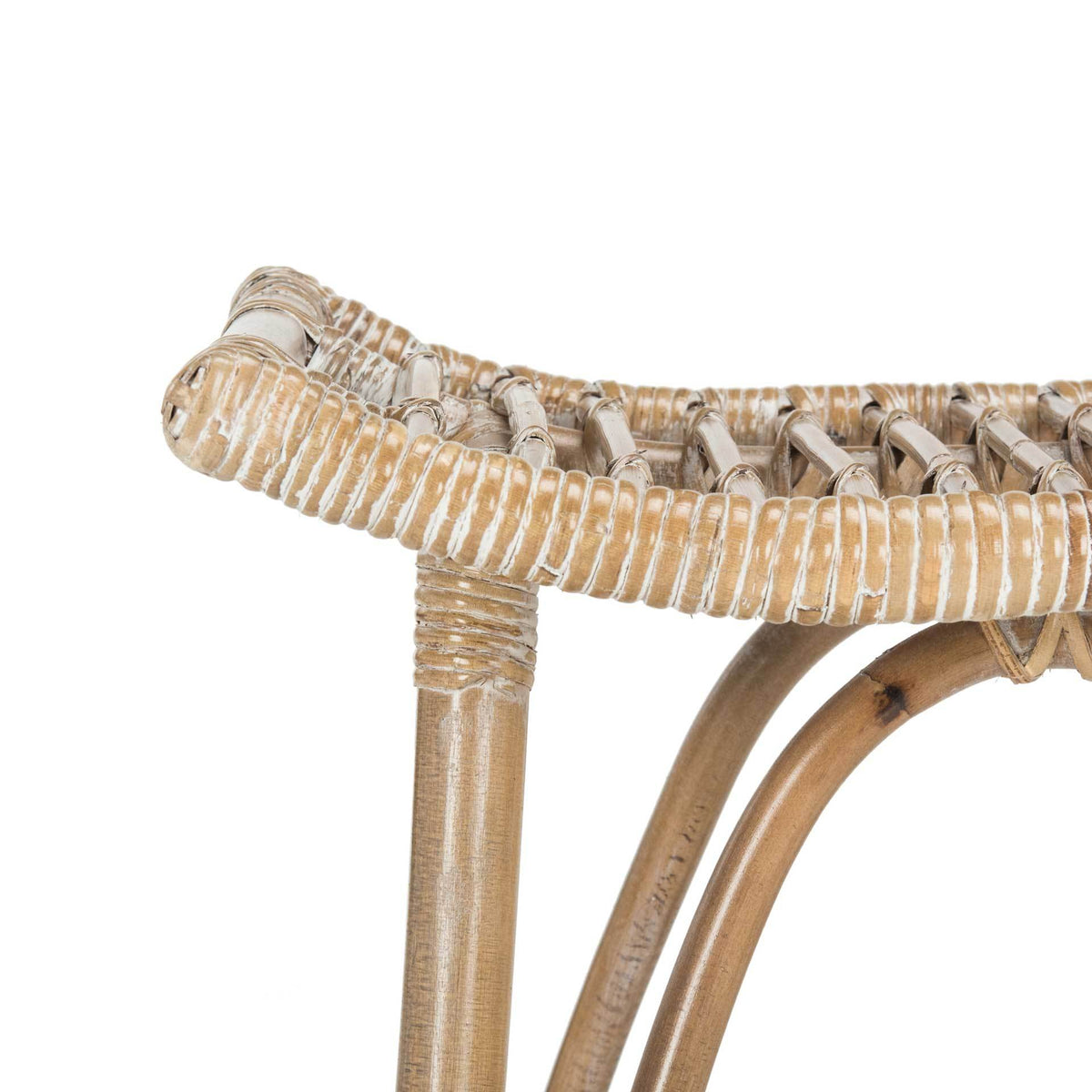 Whitewashed rattan binding wraps the counter stool's curved seat edge above smooth arched supports