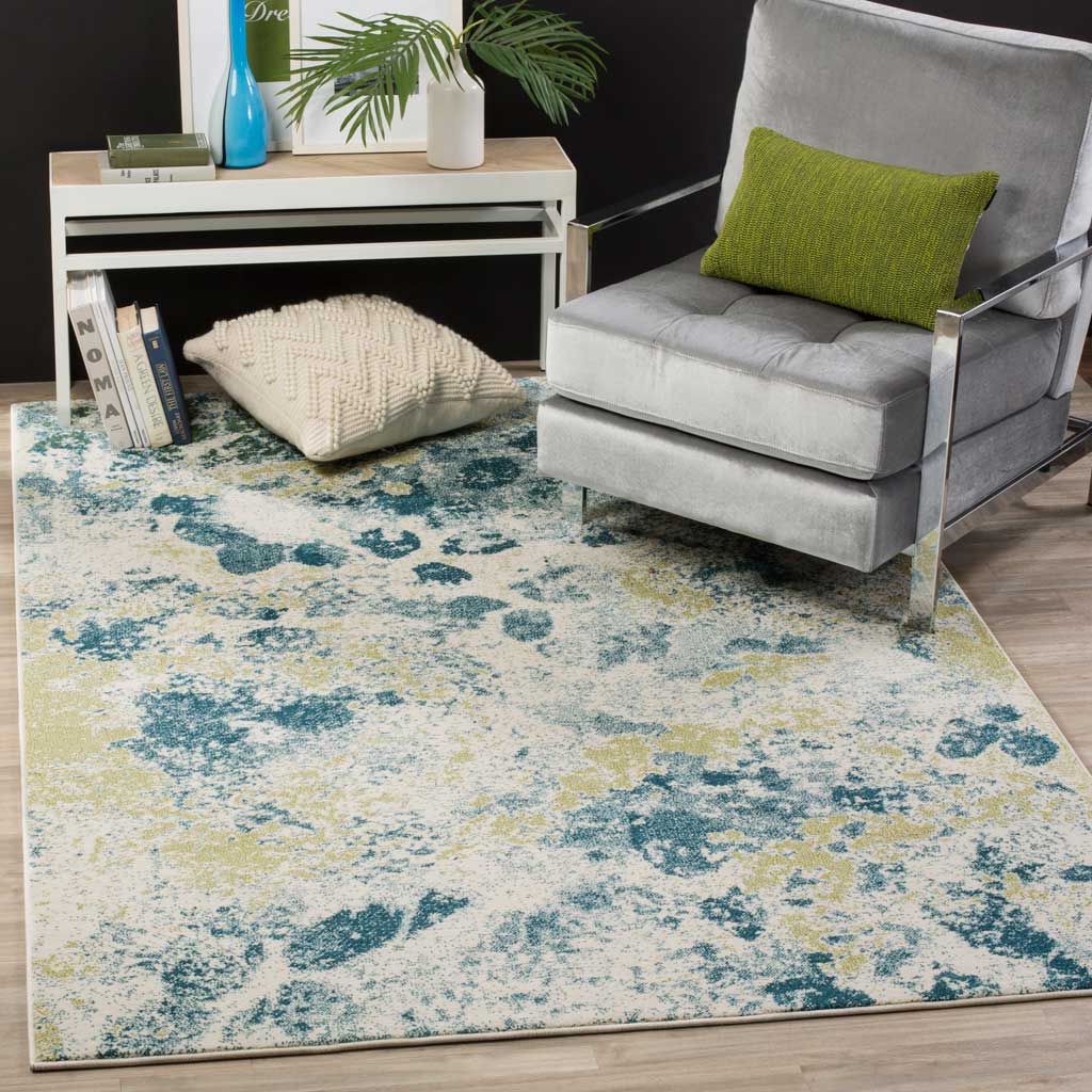 Painterly blue and soft gold markings brighten this ivory rug beneath a modern chair.