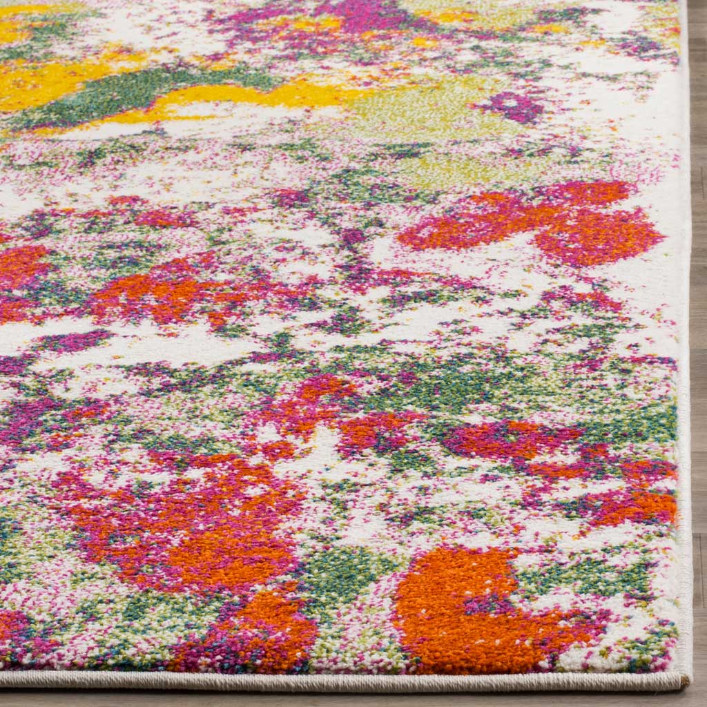 Saturated rose, green, and yellow markings animate the soft pile beside a neat bound edge.