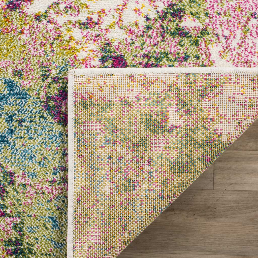 Multicolored woven backing and tidy binding complement the rug's bright abstract pile.