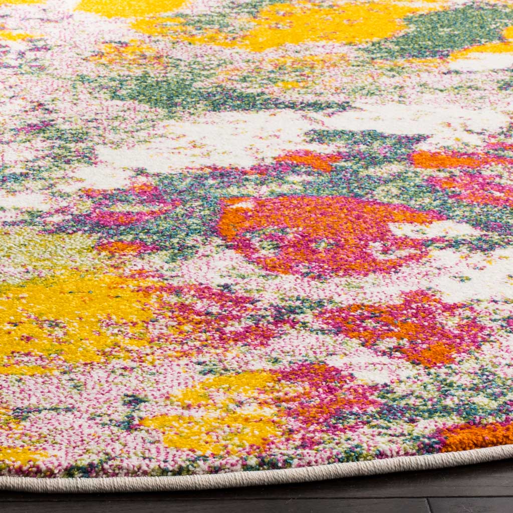 Vivid yellow, rose, and green strokes sweep over the textured pile and neatly bound edge