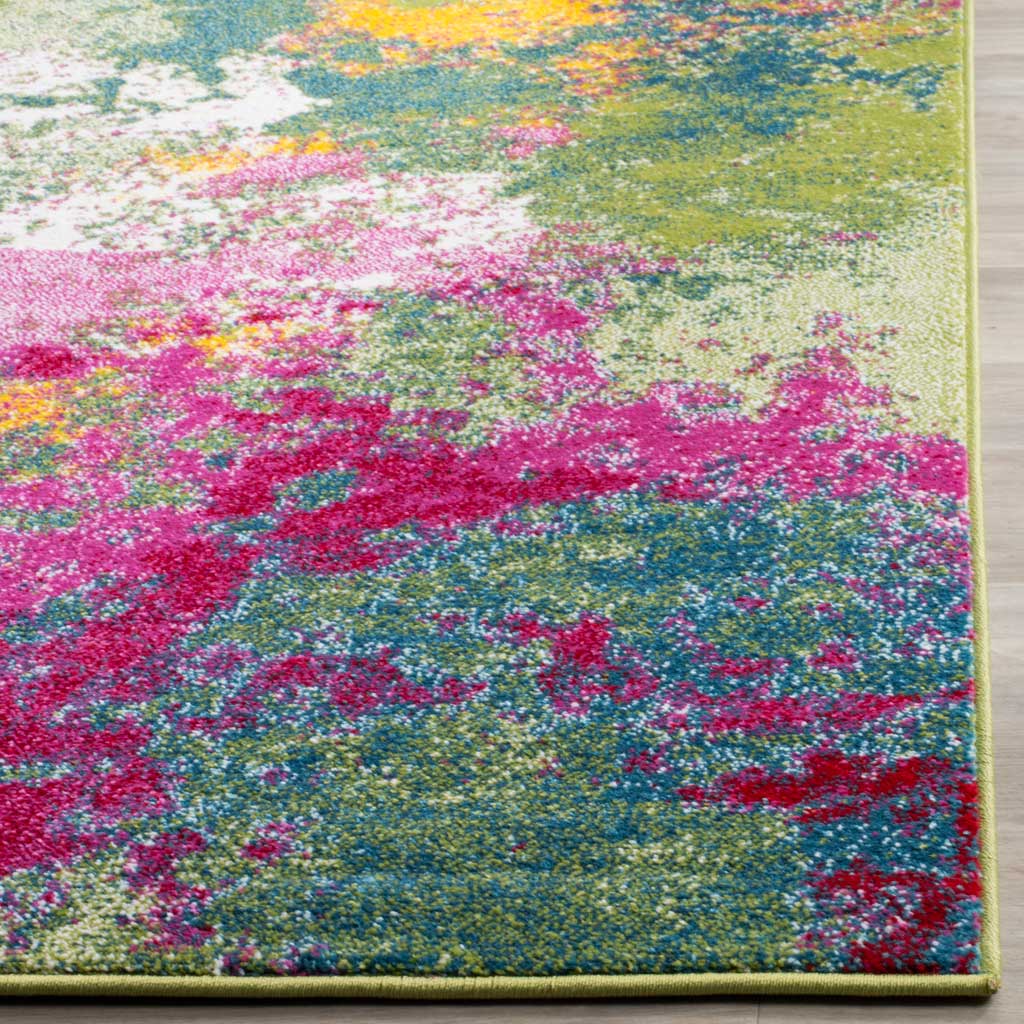 Neatly bound edges frame dense, colorful fibers in fuchsia, teal, green and yellow.