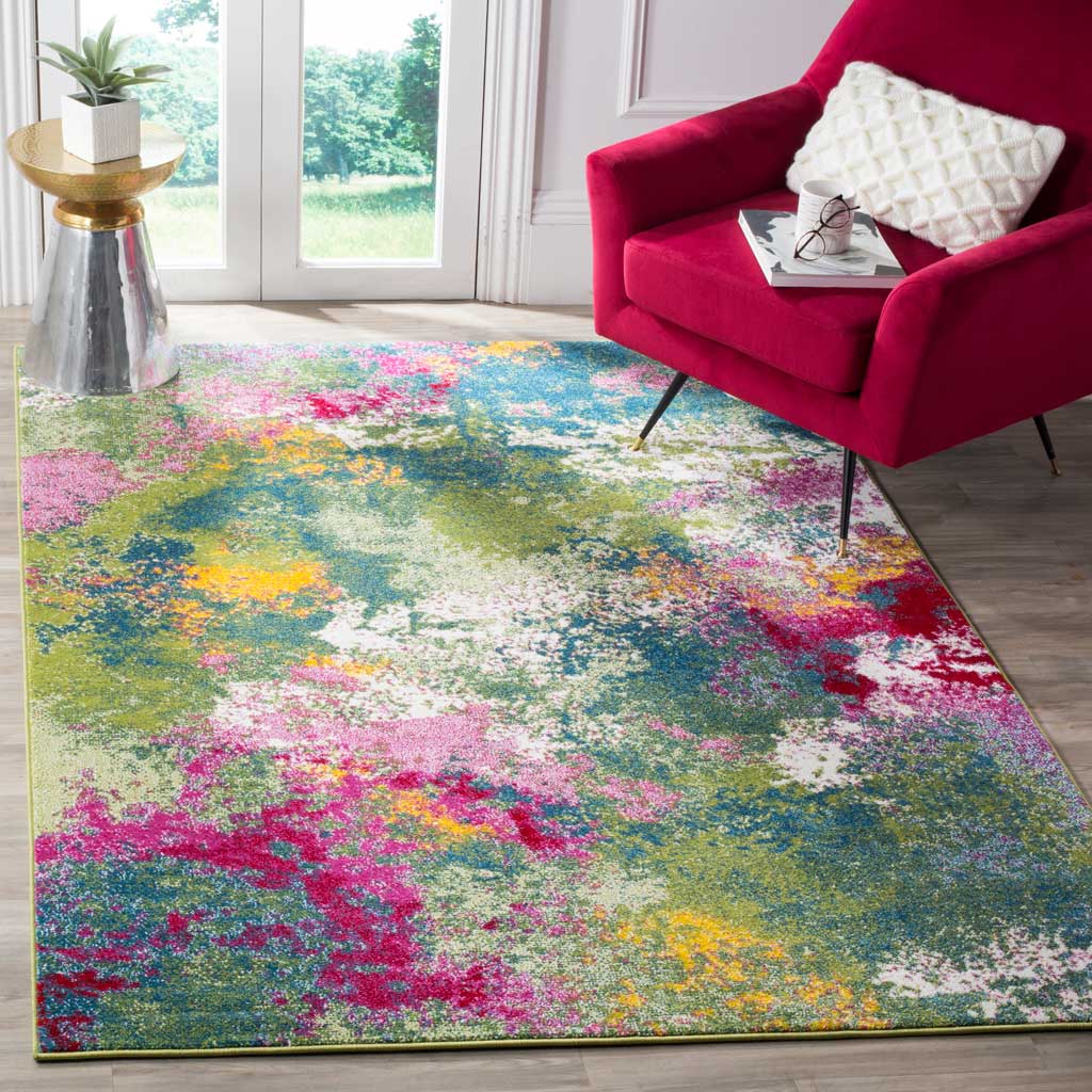 A vibrant abstract rug brightens a living area with splashes of green, teal, fuchsia and yellow.