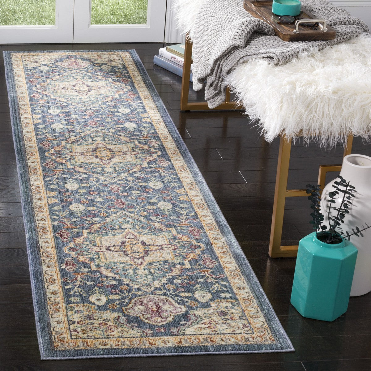 Vintage-inspired blue and purple runner adds intricate floral detail to dark wood floors