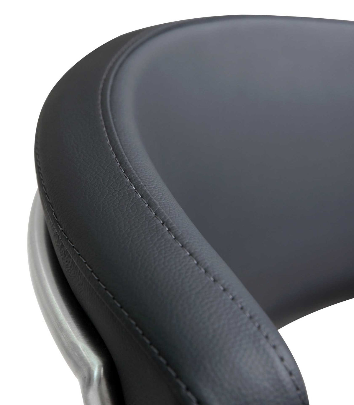 Fine stitching follows the rounded edge of the softly padded black vegan leather backrest